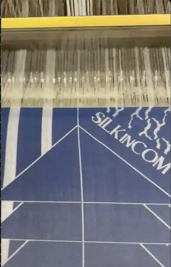 Weaving at the loom in the Como silk district